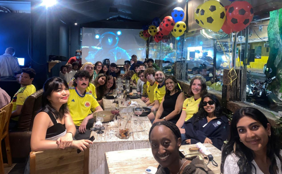 A group of interns enjoying a meal in a restaurant during their social time